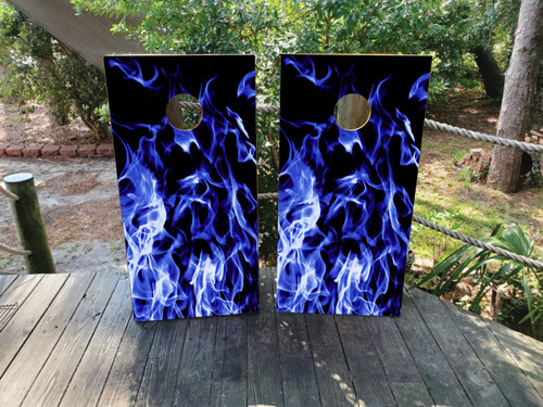 Pair of cornhole boards featuring electric blue flames rising from the bottom over a black background, creating a cool yet intense visual effect.