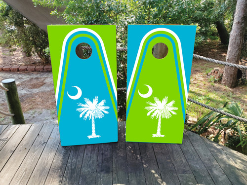 "Beachy South Carolina Professional Cornhole Boards featuring tropical beach scene, state outline, and coastal sunset design"