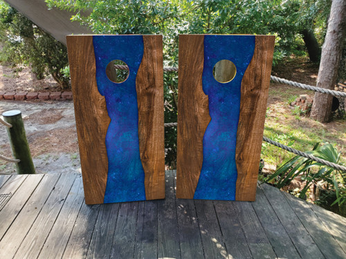 "Blue Epoxy Cornhole Boards featuring glossy resin finish with swirling blue patterns and natural wood accents"