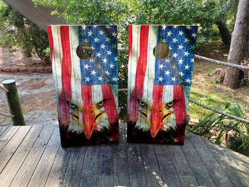 "American Eagle Cornhole Boards Design 3 featuring regulation‑size 24″×48″ birchwood boards wrapped in distressed American flag graphics with a majestic bald eagle silhouette, laminated 3M vinyl finish, and clear‑coated protection"