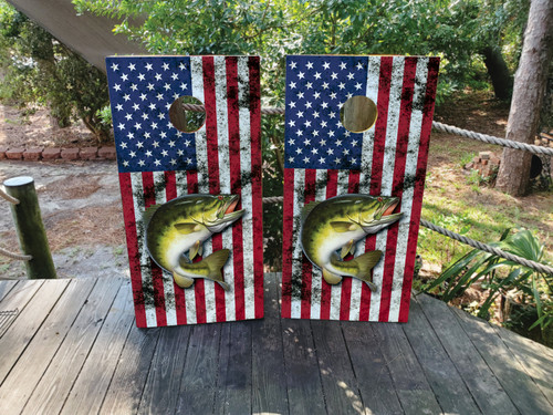 Cornhole boards featuring a fish jumping out of the water with an American flag in the background.