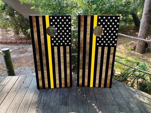 Cornhole Boards featuring a distressed USA flag with a thin yellow line paying tribute to public safety telecommunication, including police dispatchers, fire dispatchers, and ambulance dispatchers