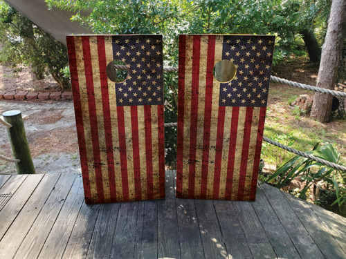 Cornhole boards featuring a distressed american flag