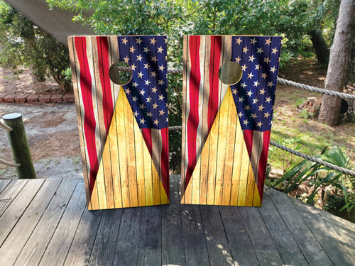 Cornhole boards featuring a gold wood grain with an american flag