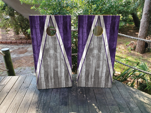 Cornhole boards featuring a natural wood grain in gray and purple
