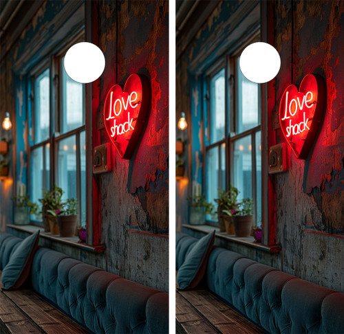 Cornhole boards featuring a boho couch with a neon sign that says love shack