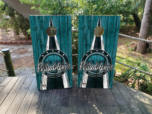 "Philadelphia Professional Sports Colors Cornhole Boards Design 2 featuring green and black color scheme inspired by Philadelphia sports teams with bold graphic design"