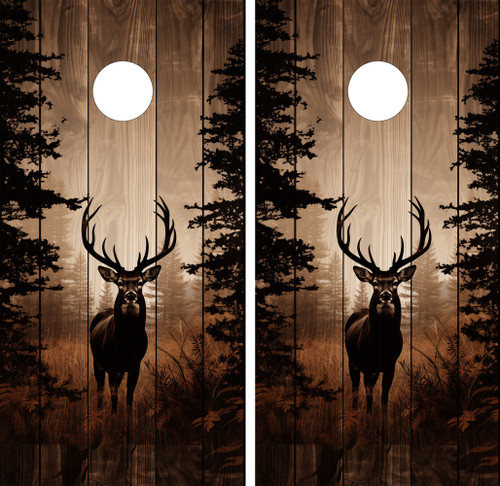 Pair of cornhole boards featuring a majestic deer with large antlers silhouetted against a woodgrain background, framed by pine trees with a glowing full moon overhead in a warm, sepia-toned forest setting.