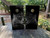 cat on a black background on a set of cornhole boards