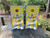 "Paradise is Just One Beach Away Cornhole Boards featuring tropical beach scene with palm trees, ocean waves, and relaxing coastal design"
