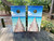 cornhole boards featuring a beach deck going out to bright blue water