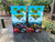 cornhole boards featuring a floating island with birds and sealife
