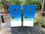 "White Sand and Palm Tree Professional Cornhole Boards featuring tropical beach scene with white sand, palm trees, and ocean background"