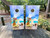 cornhole boards featuring pina coladas with a beach background
