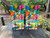 Tropical beach cornhole boards with colorful parrot, “It’s 5 O’Clock Somewhere” text, palm trees, and ocean scenery, built to professional regulation standards.