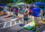 A friendly cornhole game in a parking lot