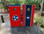 Custom Tennessee and USA flag cornhole board wraps featuring a blend of the American flag with the Tennessee state flag elements. Designs include distressed rustic styles, bold smoke patterns, and patriotic red, white, and blue color schemes, perfect for tailgates, backyard games, and state pride events.