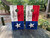 Cornhole boards featuring a wooden waving TX flag