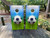 Cornhole boards featuring a soccer ball on a soccer field