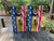 Cornhole boards with a deer in the woods and an american flag on either side