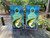 Cornhole boards featuring a fish jumping out of the water with an colorful blue background