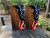 Cornhole boards featuring an American flag draped on wood