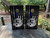Custom cornhole boards featuring a black and white USA/American flag with a thin blue line