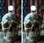 Pair of cornhole boards featuring a weathered, realistic human skull in the foreground with a blurred vintage American flag in the background, creating a gritty, patriotic atmosphere.
