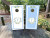 blue and white wedding cornhole boards featuring a custom wedding crest