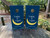 Custom wedding cornhole boards featuring a navy blue background with a crescent moon and starry night sky design. The boards are personalized with the names “Felicity & Logan” in elegant white script, making them a unique and romantic wedding game set for outdoor celebrations.