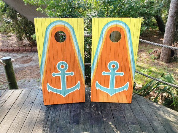 Yellow and orange wood grain cornhole boards