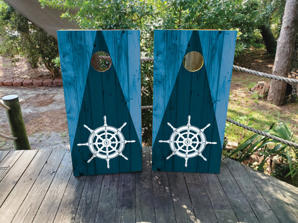 cornhole boards featuring a Blue Wood Grain and white ships wheel