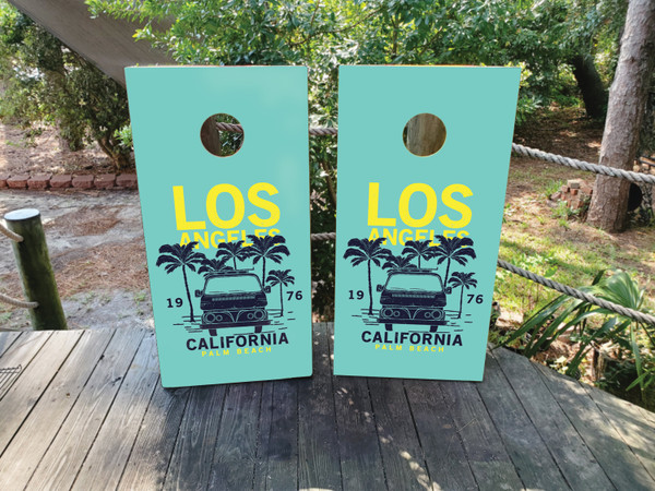 "Palm Beach Cornhole Boards featuring tropical beach scene with palm trees, ocean waves, and vibrant coastal design"