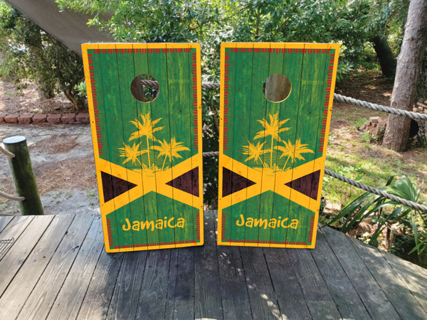 "Jamaican Flag Weed-Themed Cornhole Boards featuring marijuana leaf with Jamaican flag colors and reggae-inspired tropical design"