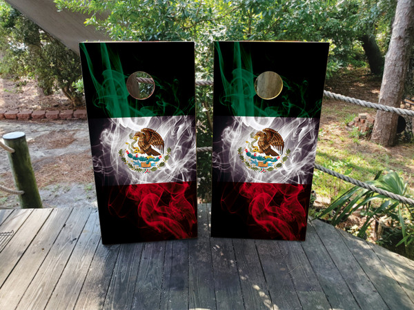 Cornhole boards featuring a smokey mexican flag