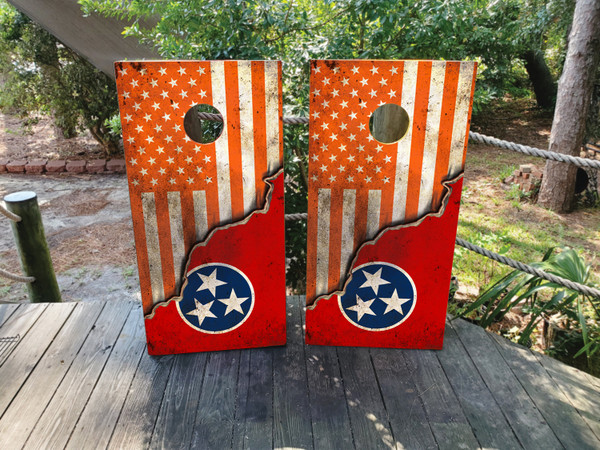 Cornhole boards featuring an orange USA flag on the top and TN flag on the bottom.
