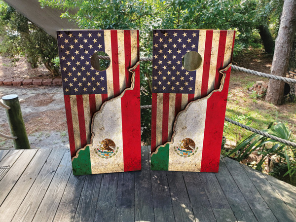 Cornhole boards featuring a distressed USA Flag on top and a Mexican Flag on the bottom