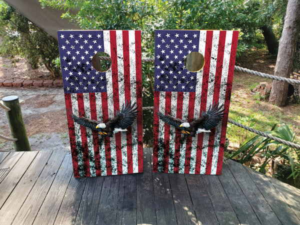 "American Eagle Cornhole Boards Design 5 featuring regulation-size 24″×48″ birchwood boards wrapped in a bold American flag and majestic bald eagle graphic, with laminated 3M vinyl finish, clear-coated for durability, and reinforced construction"