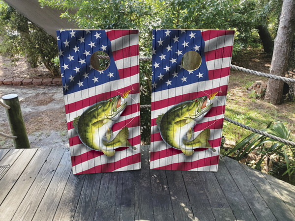 Cornhole boards featuring a fish jumping out of the water with an American flag in the background.