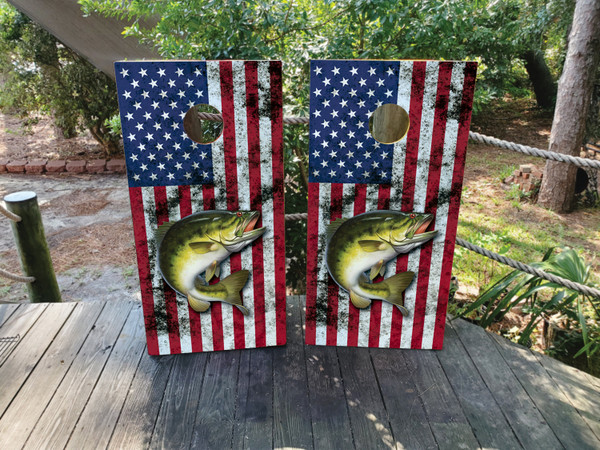 "USA Flag & Fishing Cornhole Boards Design 3 featuring an American flag backdrop with a leaping fish motif on regulation‑size birch boards built for professional play"