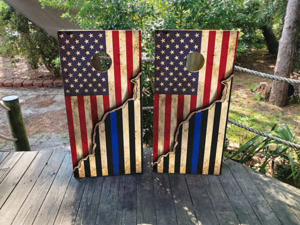 "USA Thin Blue Line Police Flag Cornhole Boards Design 2 featuring regulation‑size boards wrapped in a black & white American flag with a bold thin blue line stripe honoring law enforcement"