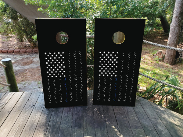 “Pledge of Allegiance Thin Blue Line USA Flag Cornhole Boards featuring script of the Pledge of Allegiance over a Black & White American flag with Thin Blue Line overlay honoring police”