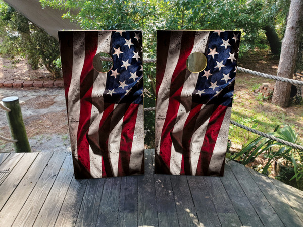 Cornhole boards featuring a waving distressed USA American flag