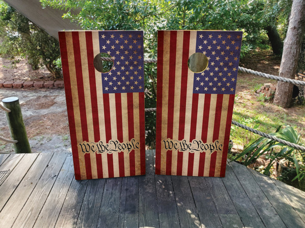Cornhole boards featuring a USA American flag with We The People