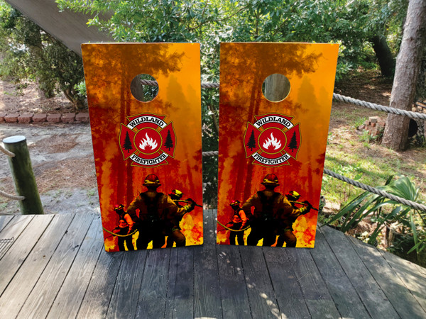 "Wildland Firefighter Cornhole Boards featuring firefighter silhouette with forest fire background and patriotic elements honoring first responders"
