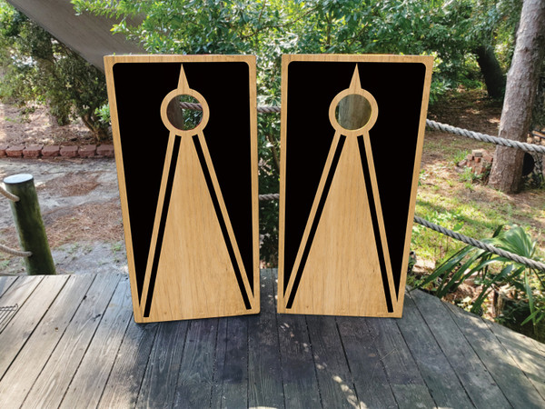 Cornhole boards featuring a natural wood grain and black design