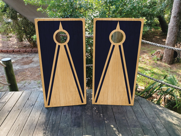 Cornhole boards featuring a natural wood grain and navy design