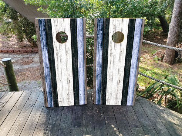 Cornhole boards featuring a natural wood grain in blue, white and navy