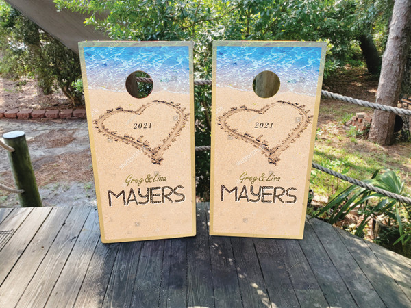 "Custom Wedding Cornhole Boards Design 6 featuring personalized names and date with tropical beach theme and heart design"