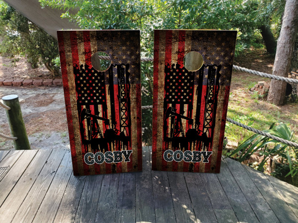 Custom cornhole boards featuring an oil rig, drill